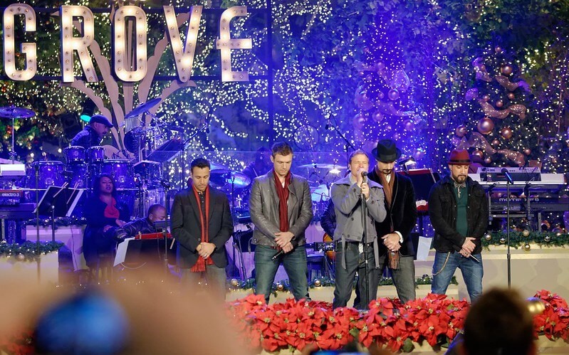 A live performance by the Backstreet Boys, a popular boy band, with the members singing and dancing on stage.